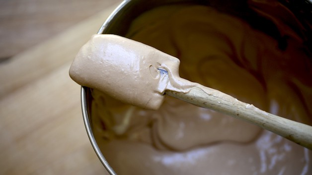 spatula in bowl showing lightly whipped chocolate mixture