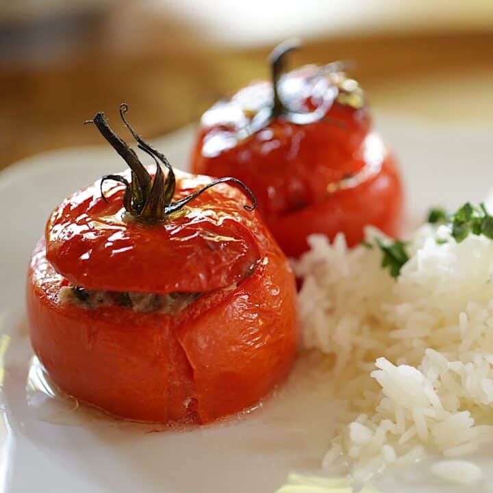 Stuffed Tomatoes on a plate with Rice