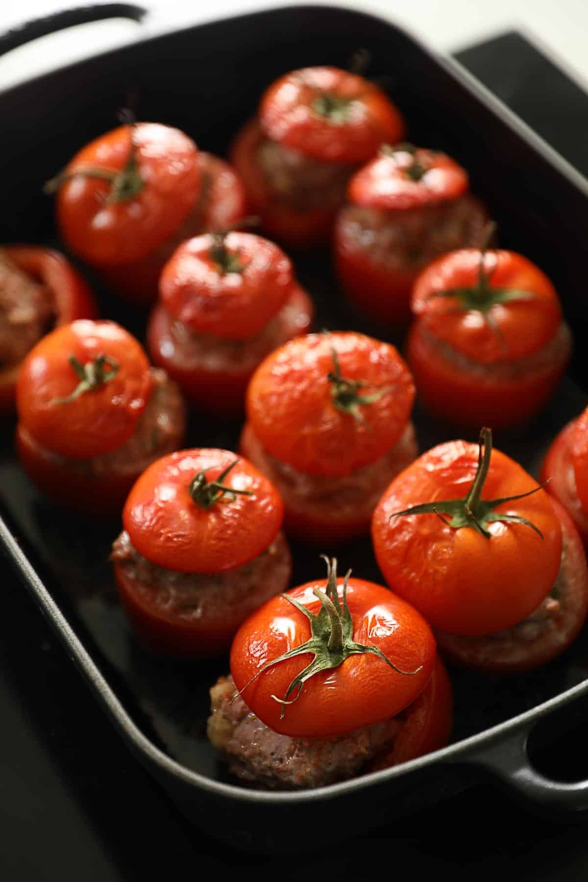 a casserole filled with baked stuffed tomatoes.