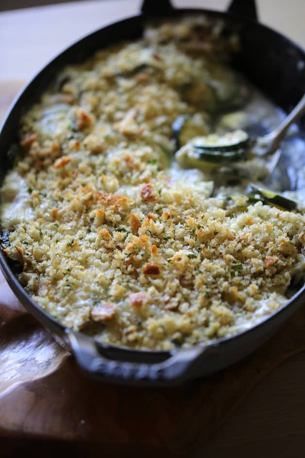 Vertical Image of baked zucchini with bread crumbs on top