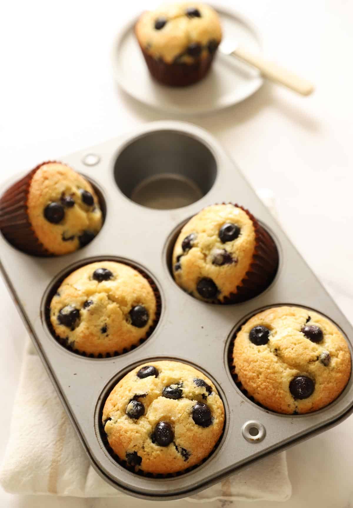 a jumbo muffin tin filled with freshly baked muffins