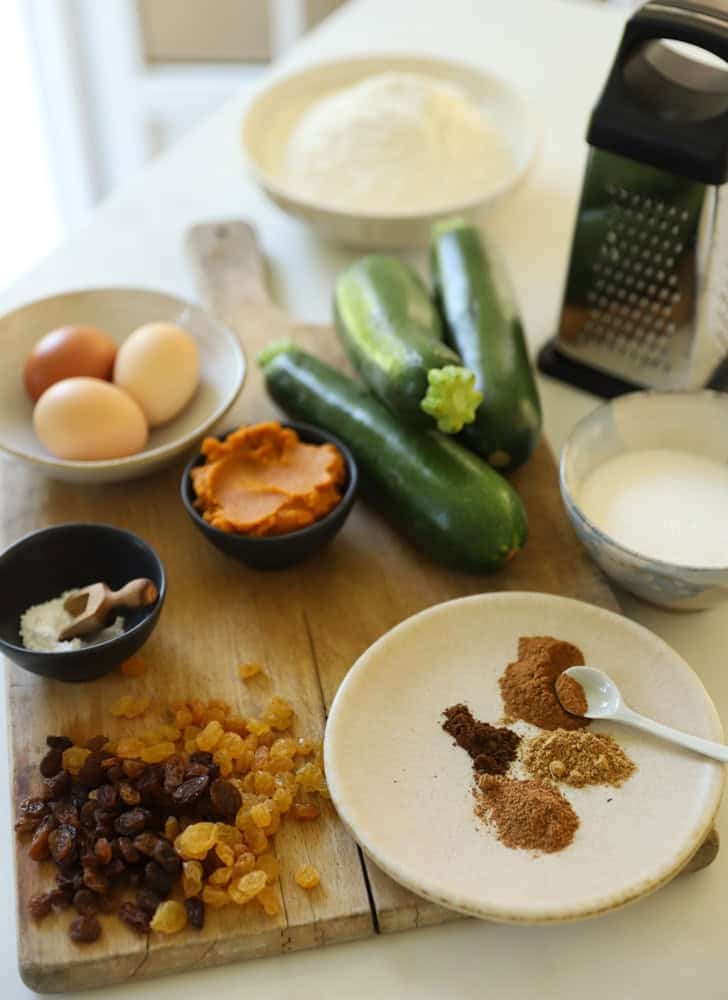 Ingredients for zucchini bread laid out on a counter.