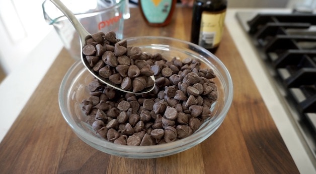 A spoon in a bowl of semi-sweet chocolate chips