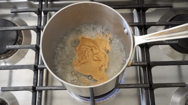 hot sugar water simmering with peanut butter added