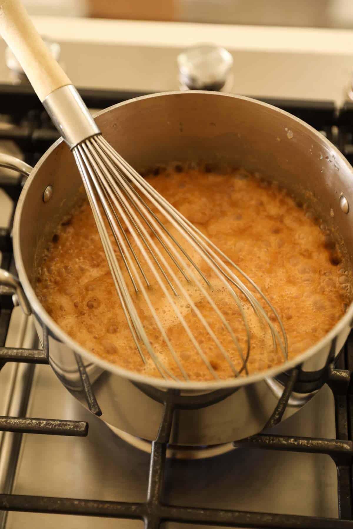 a frothing boiling mixture of peanut sauce