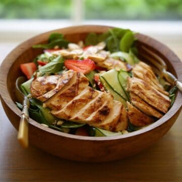 Strawberry Spinach Salad in a wooden bowl