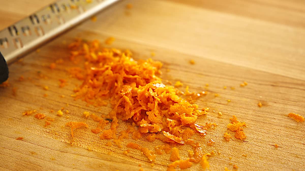 Orange zest and grater on a board
