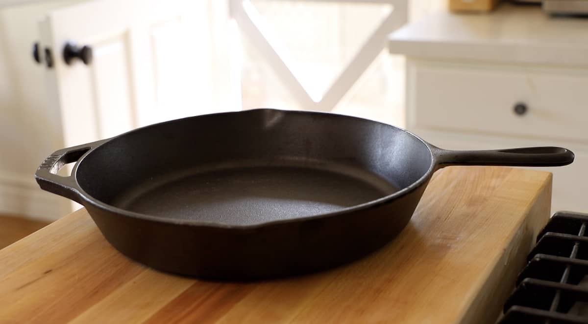 cast iron skillet on a cutting board