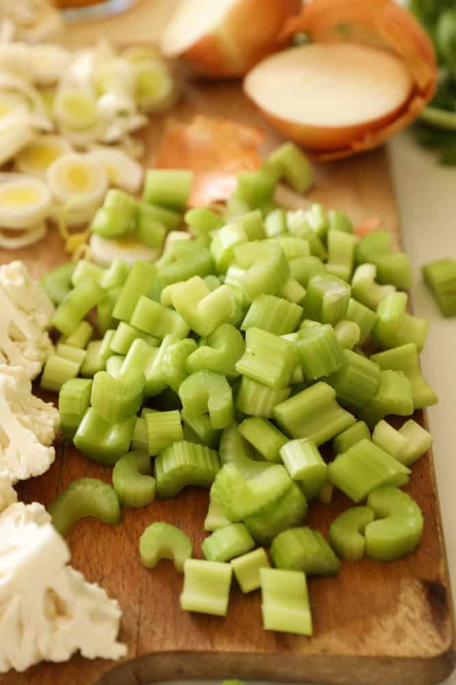chopped celery on a board.