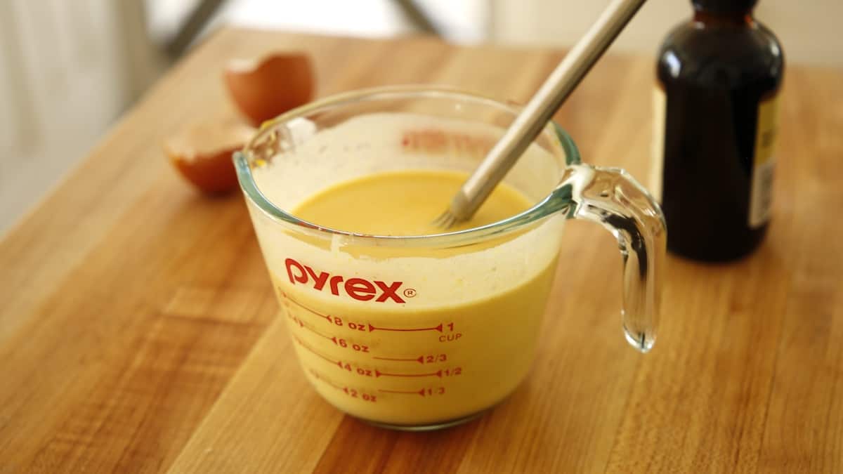 a picture with heavy cream and pumpkin puree with whisk