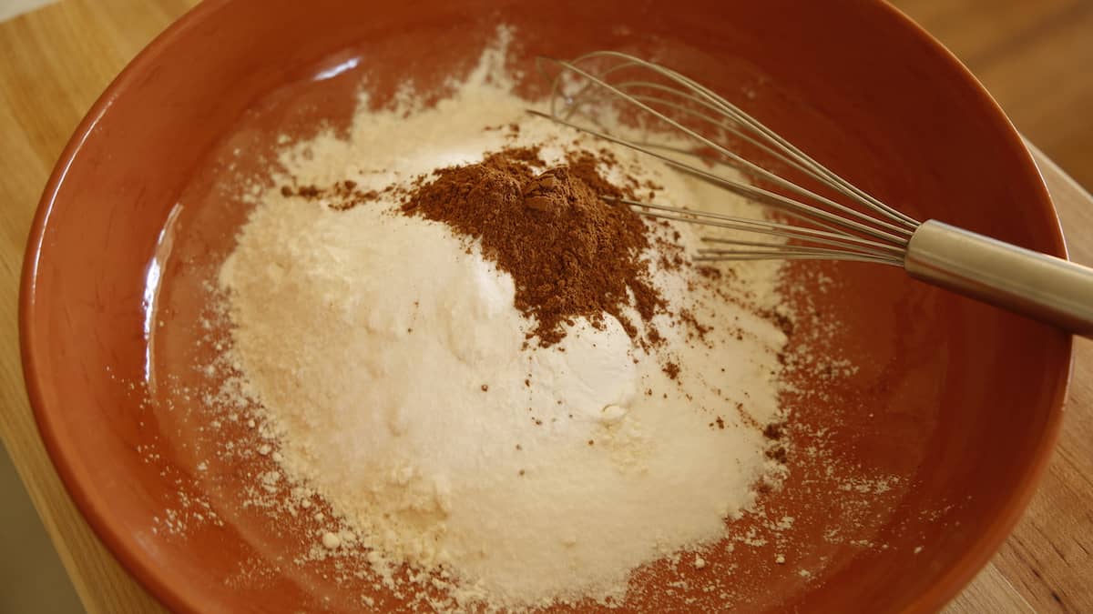 Dry ingredients in a bowl with a whisk