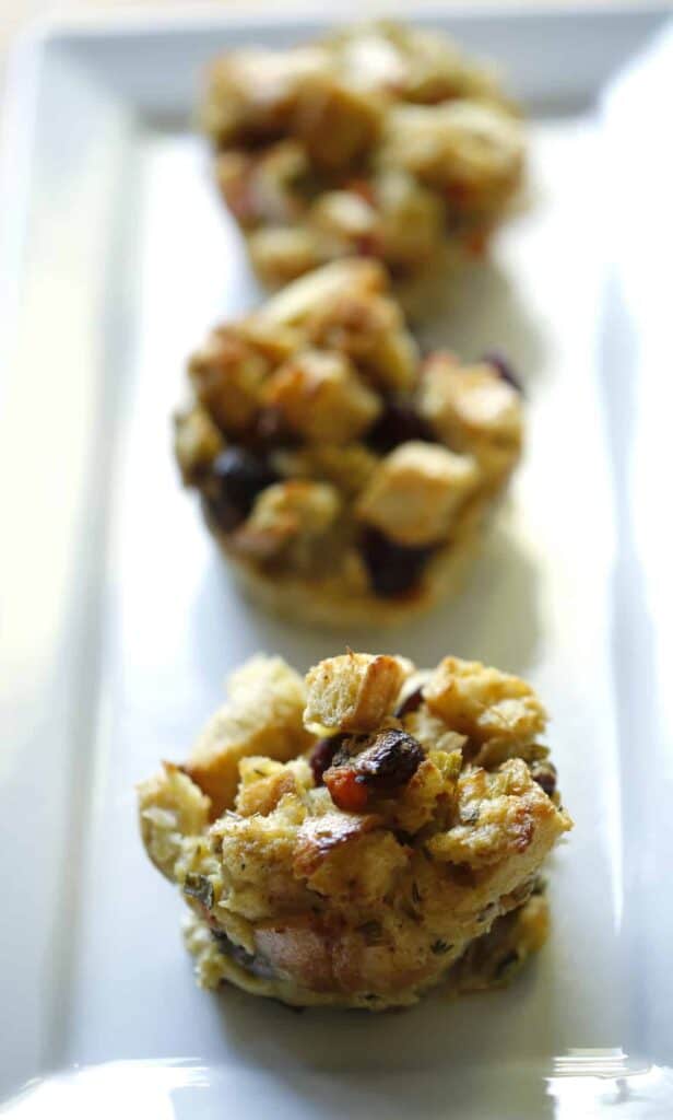 vertical image of Stuffing Muffins on a Rectangular white platter