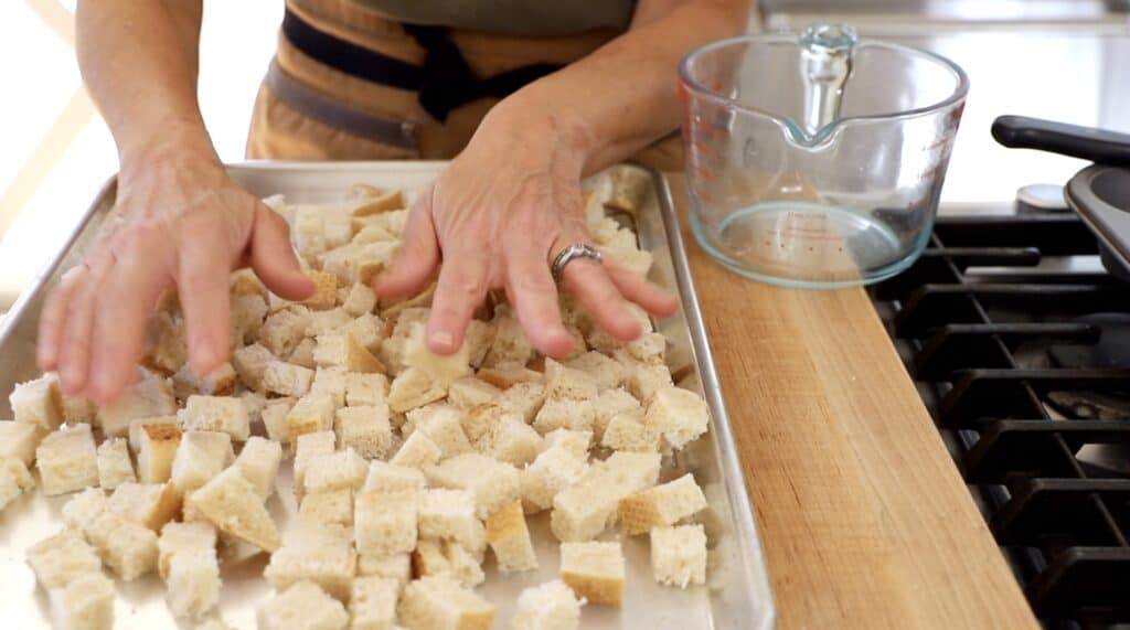 bread cubes laid out on a sheet pan