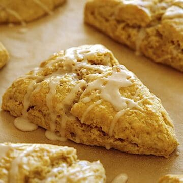 pumpkin scones baked and drizzled with glaze