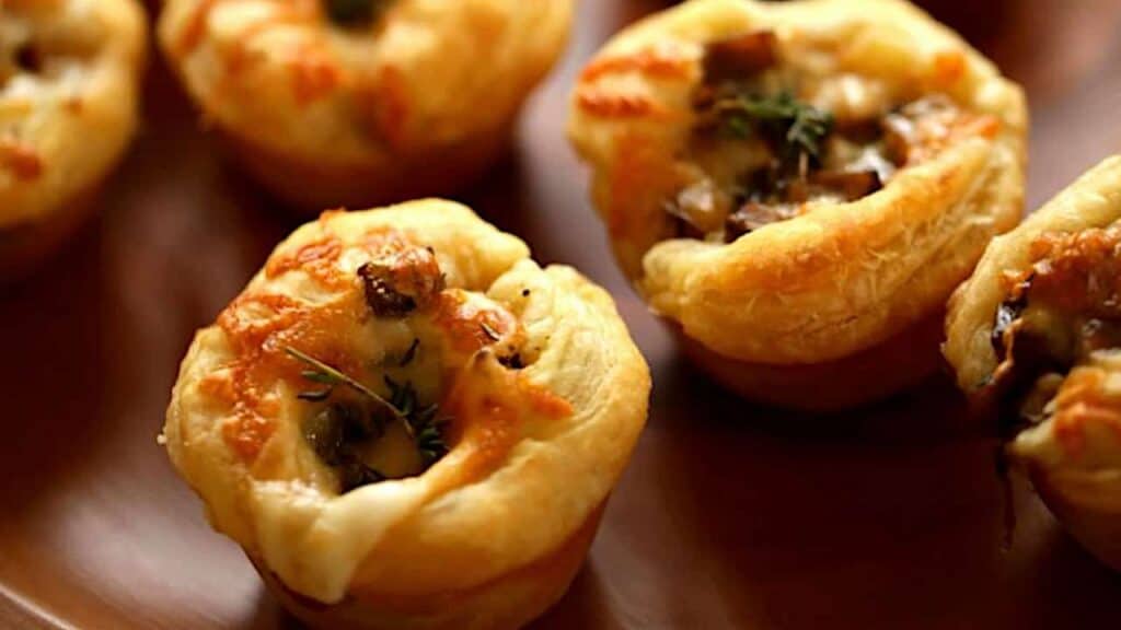 Close up of Mushroom Tartlets on a Wooden Board