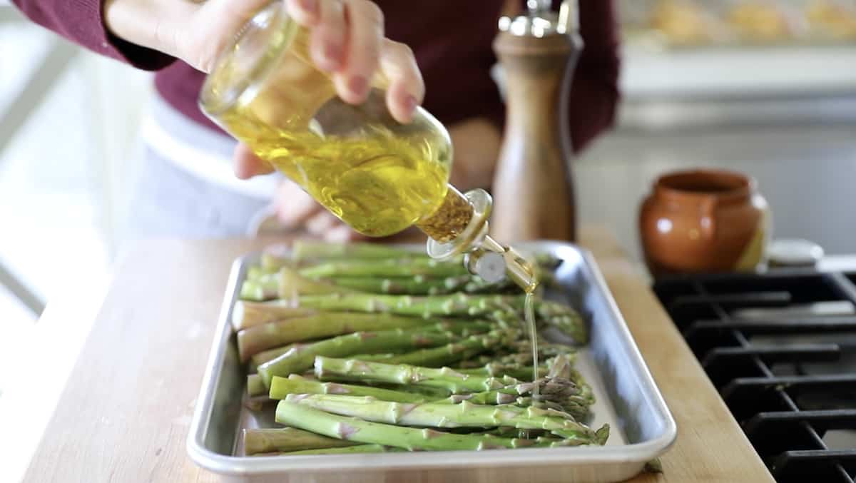 Drizzling Olive Oil on to Asparagus