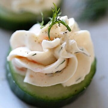 Salmon Mousse on Cucumber slices with dill garnish