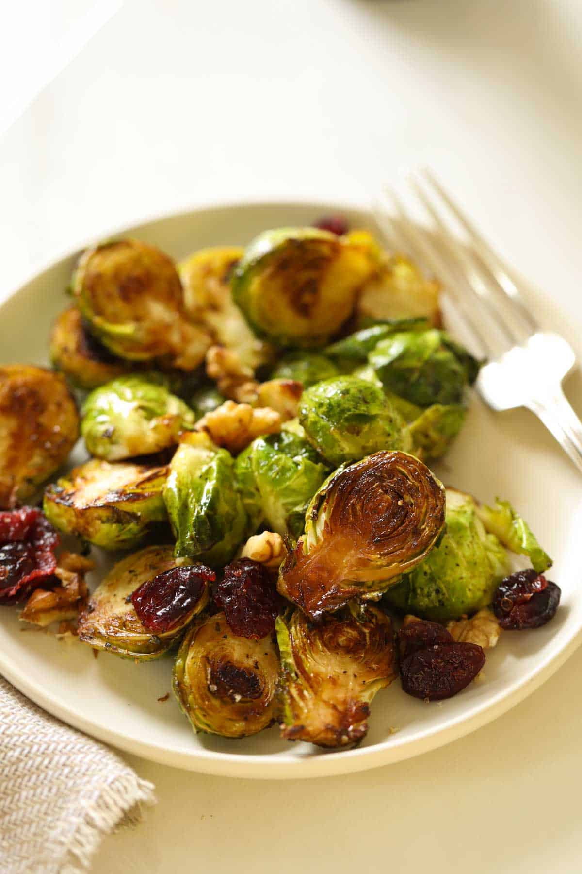 A plate of brussels sprouts that have been air fried.
