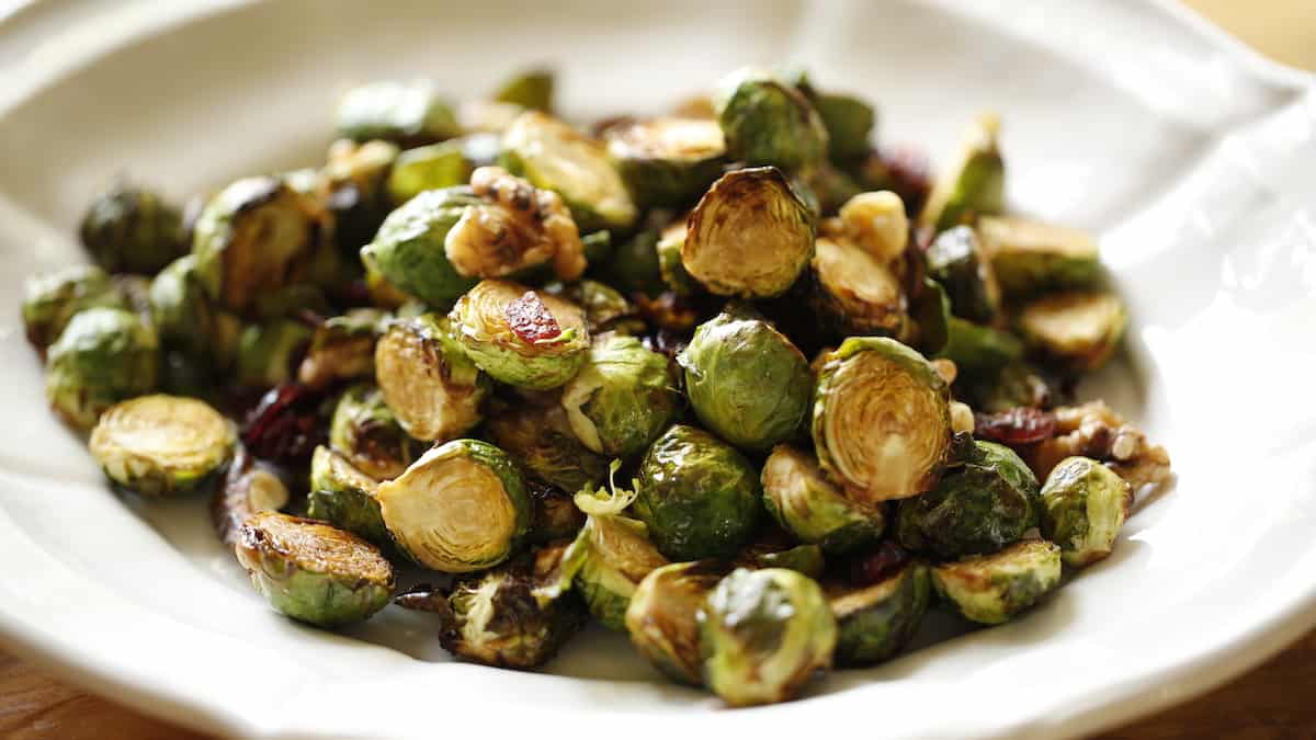 wide shot of Air ryer Brussel Sprouts on a small oval platter