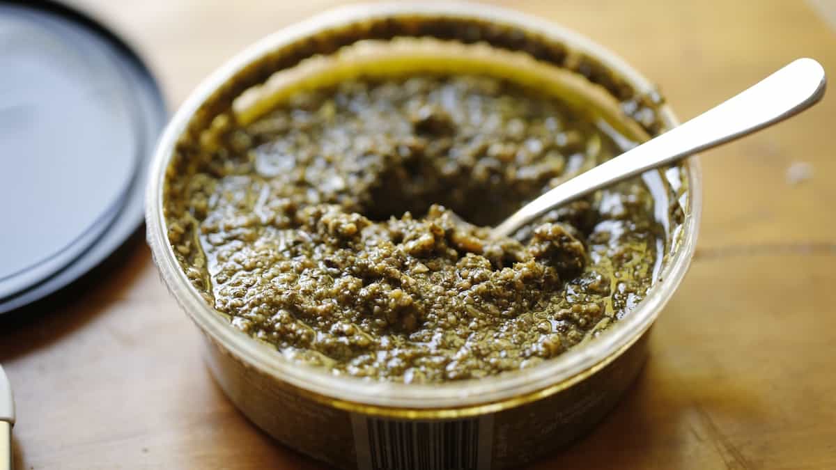 a tub of store-bought pesto sauce