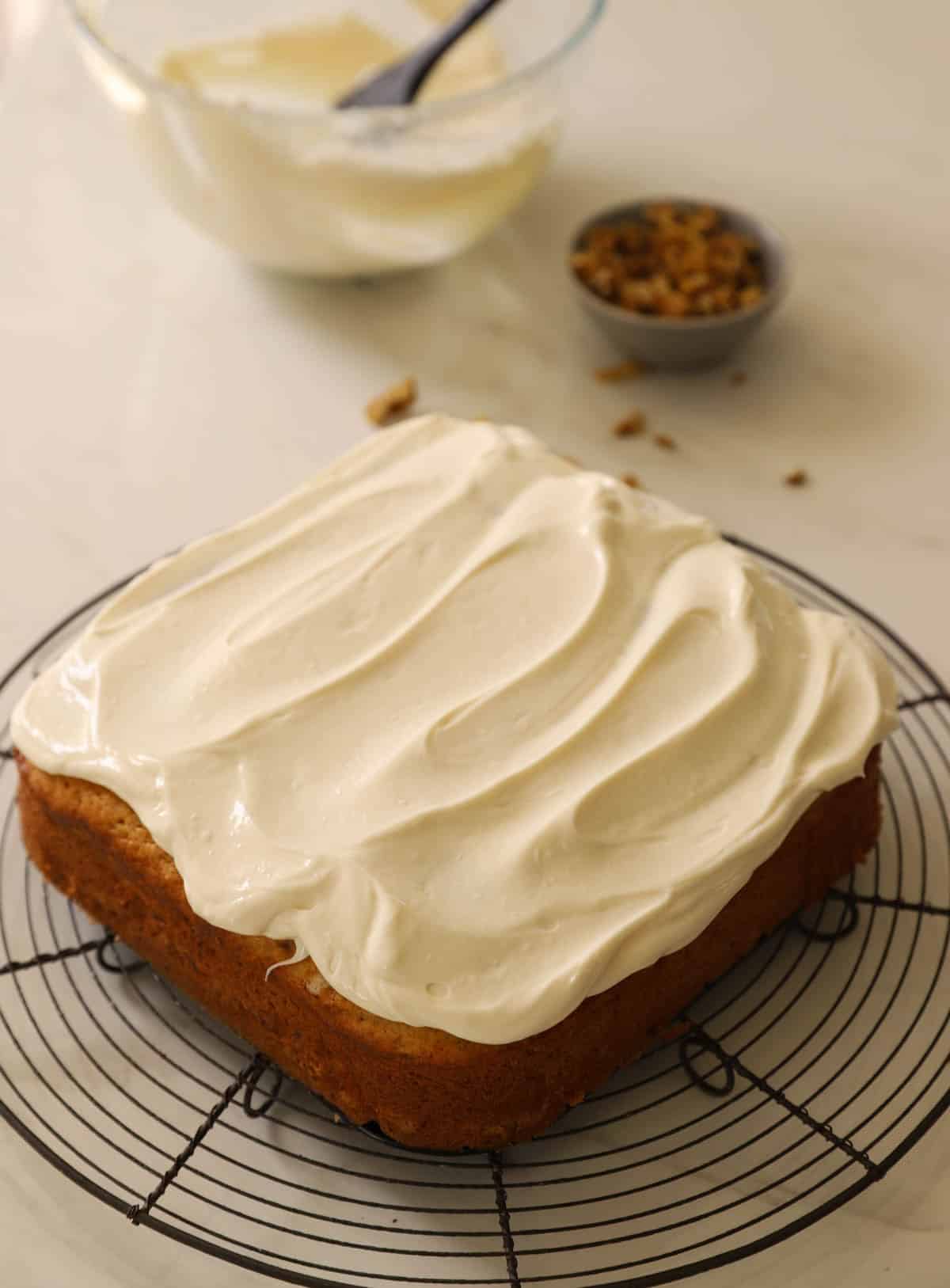 A banana cake topped with silky cream cheese frosting.