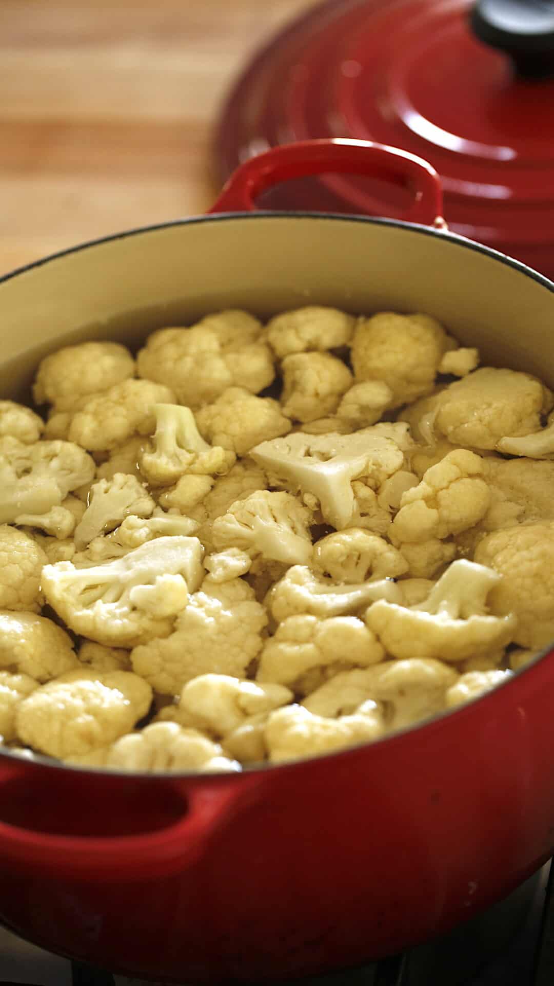 Cauliflower boiling in pot of water