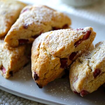Strawberry Scones dusted with powdered sugar on a platter