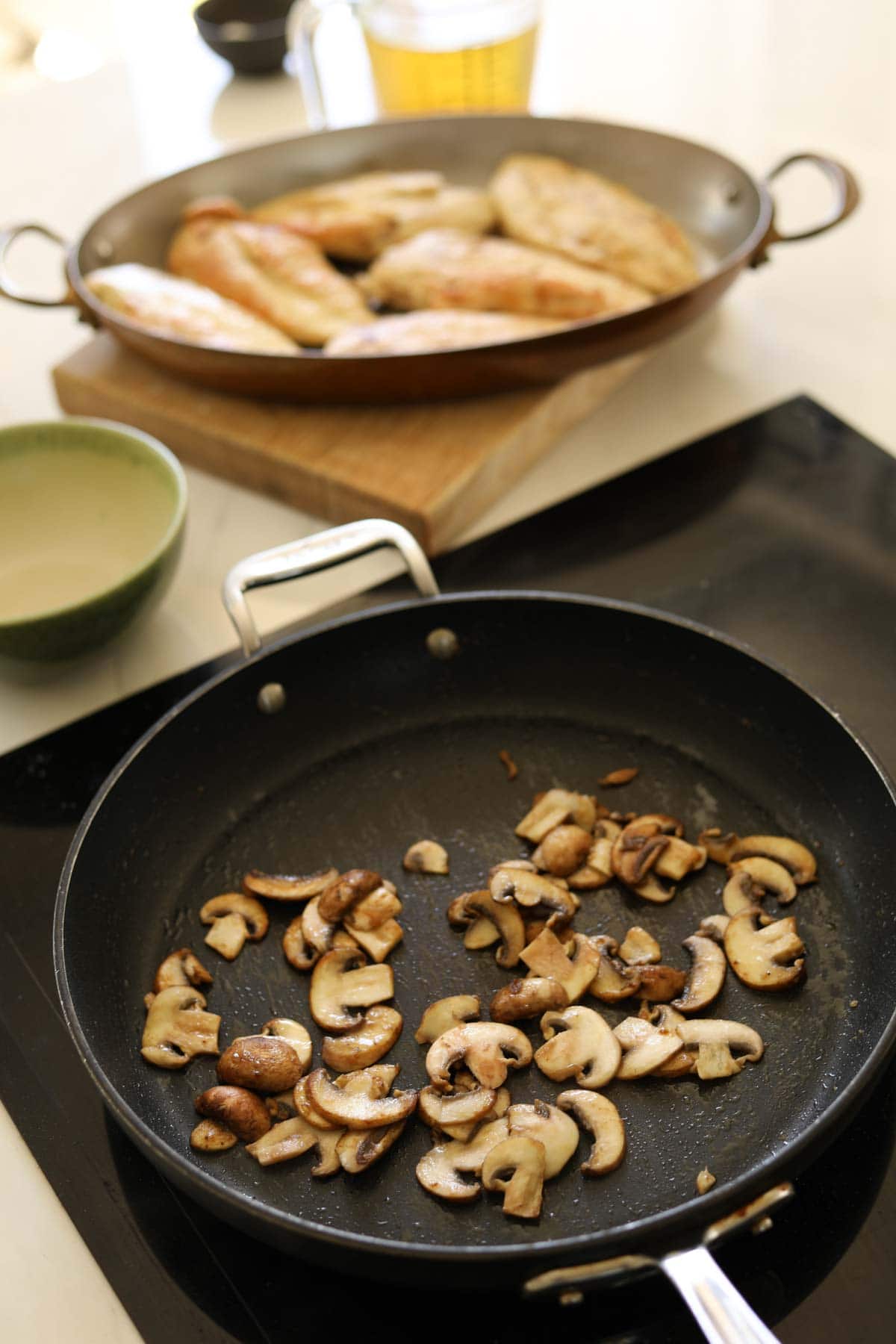 Mushrooms browning in a skillet