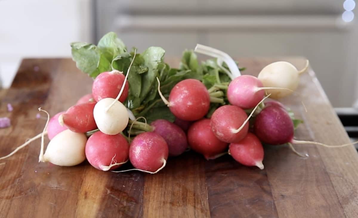 Two Bunches of Easter Egg Radish on a cutting Board