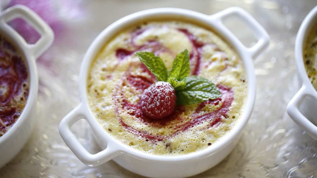 White Ramekin filled with a baked lemon bar filling and brownie bottom