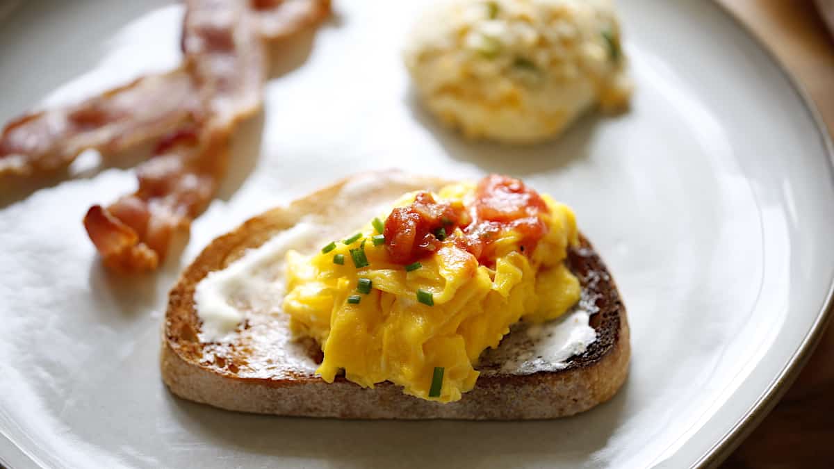 Scrambled eggs on toast of buttered toast with Salsa