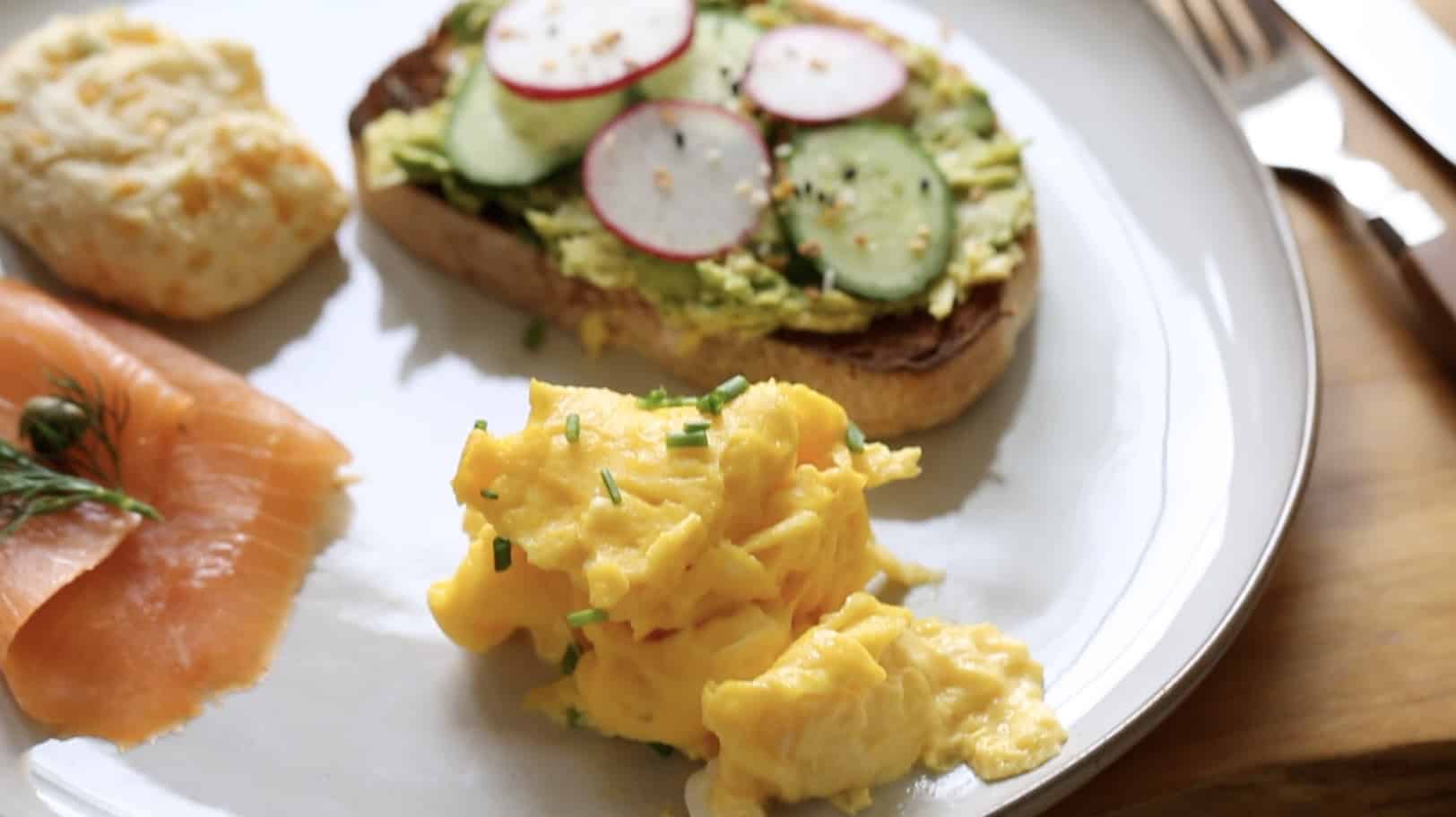 a plate of Avocado Toast eggs and salmon