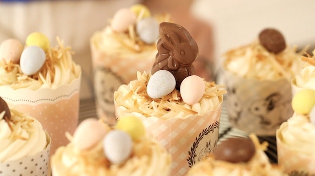 an assortment of Easter Cupcakes decorated with chocolate eggs and a bunny