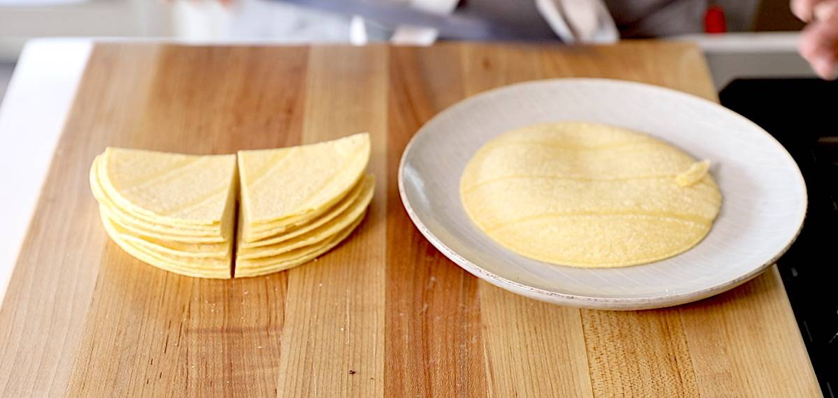 corn tortillas on a plate and cut in quarters