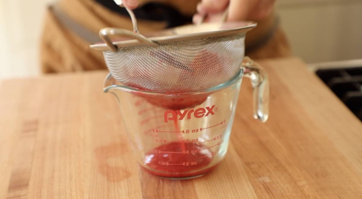Pressing Raspberries through a fine-mesh sieve