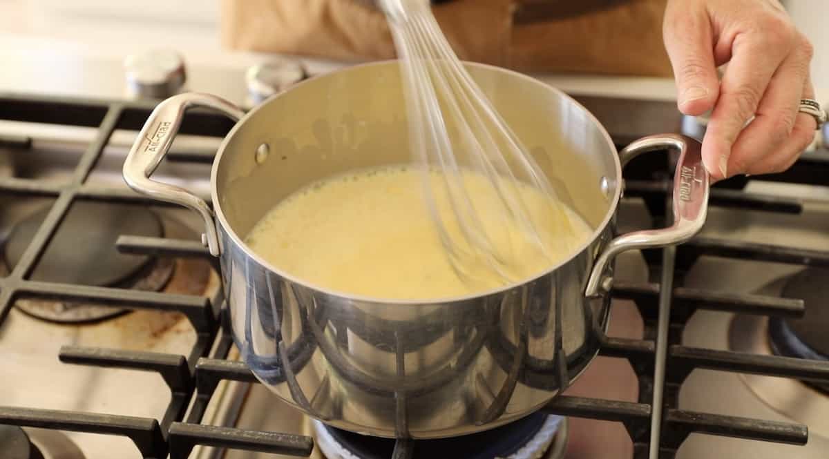 making the pastry cream in a pot with a whisk