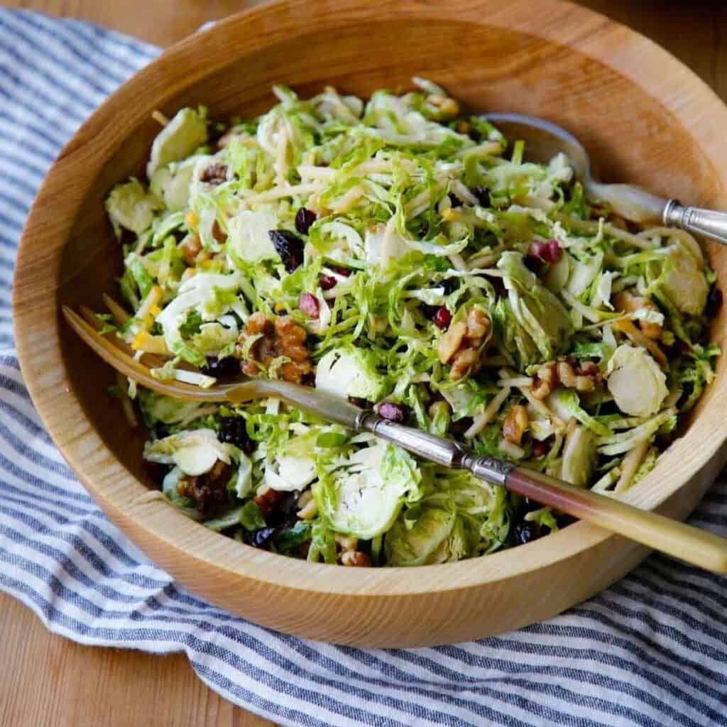 Shaved Brussels Sprout Salad in a Wooden Bowl