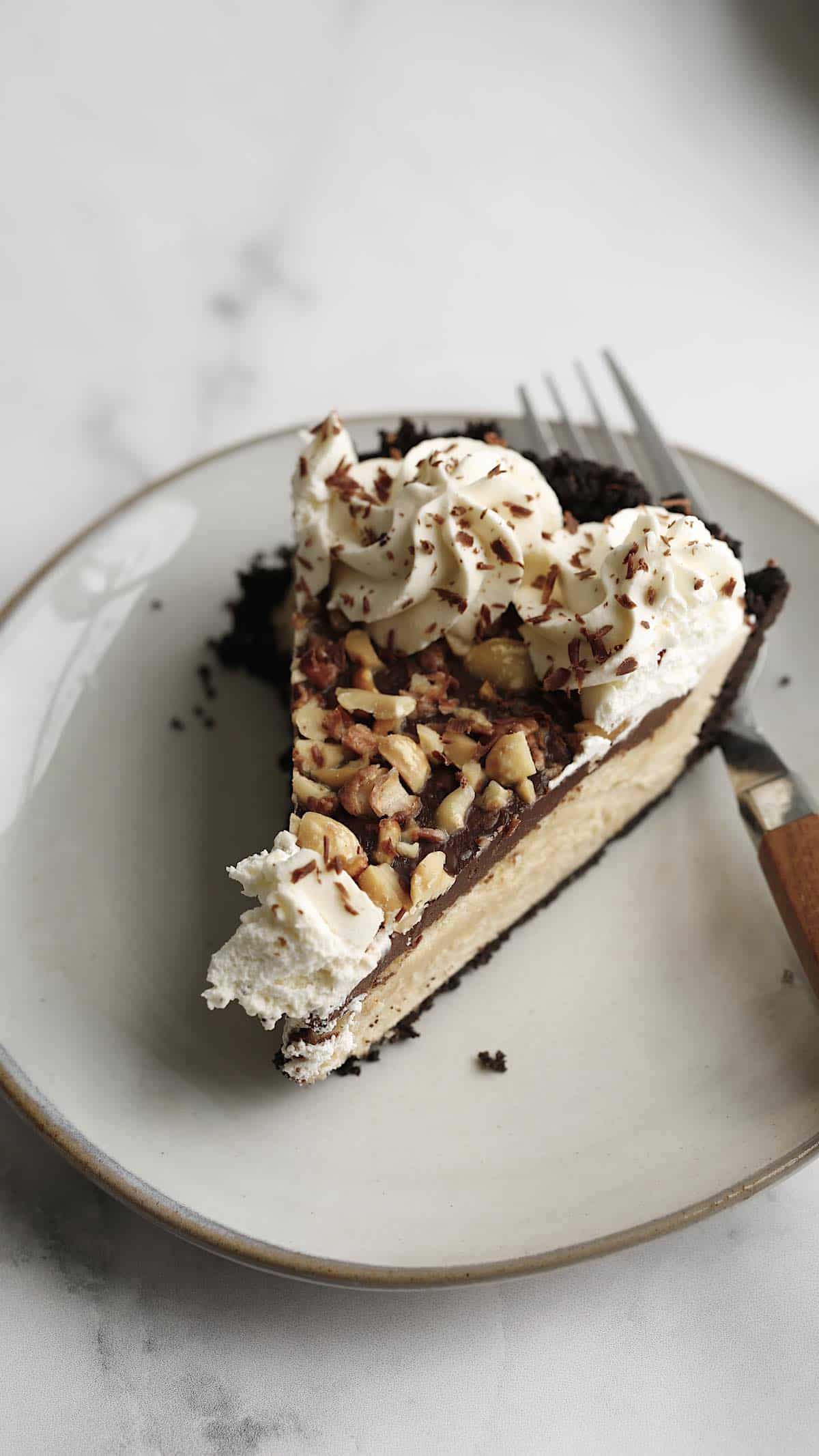 a slice of Chocolate Peanut Butter Pie on a plate with a fork