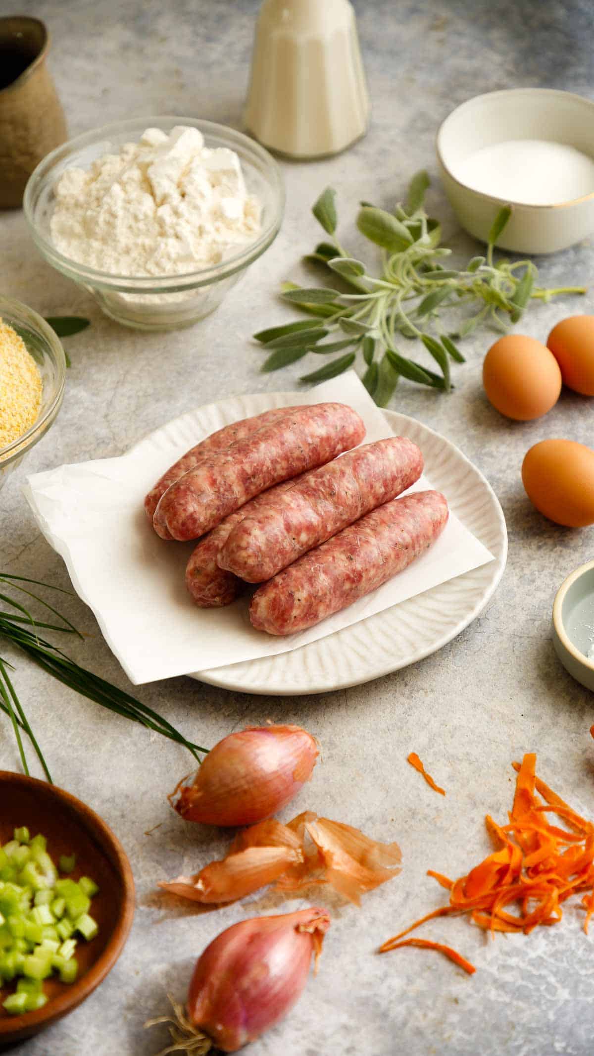 Ingredients laid out on a counter for sausage and cornbread stuffing