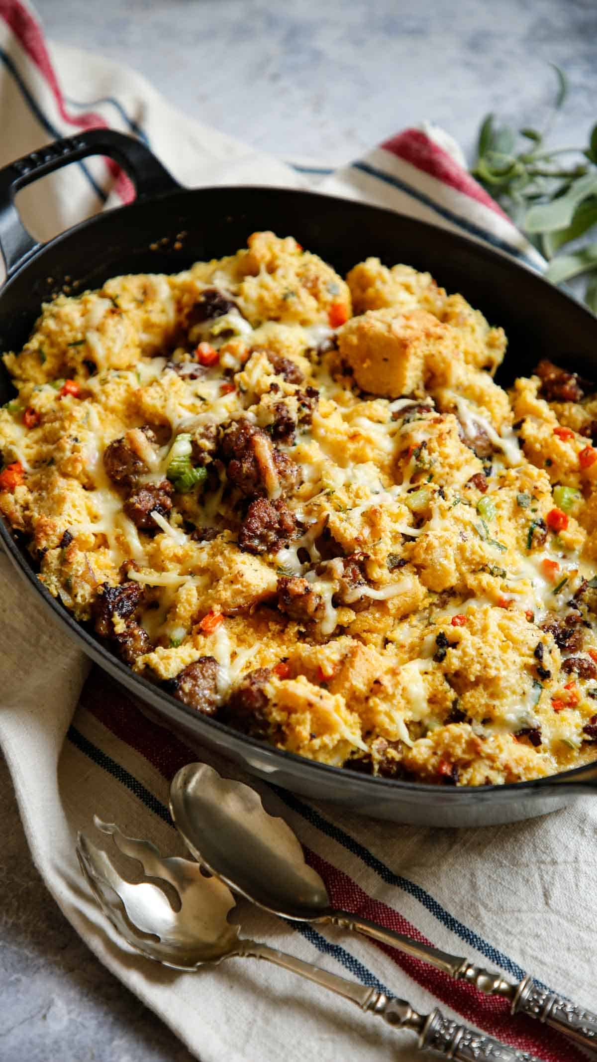 A vertical image of freshly baked cornbread stuffing with sausage