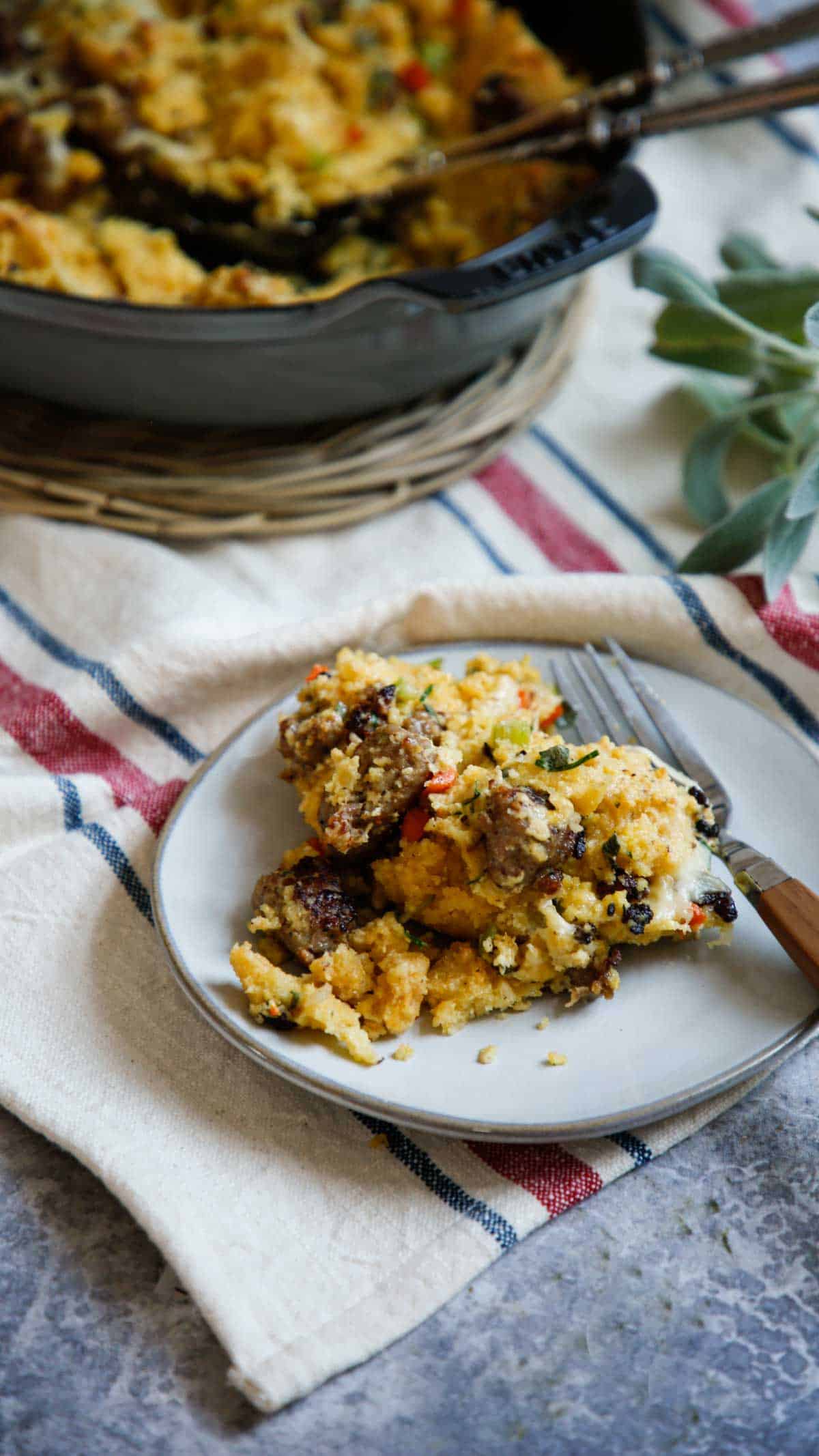 a portion of stuffing placed on a plate with fork