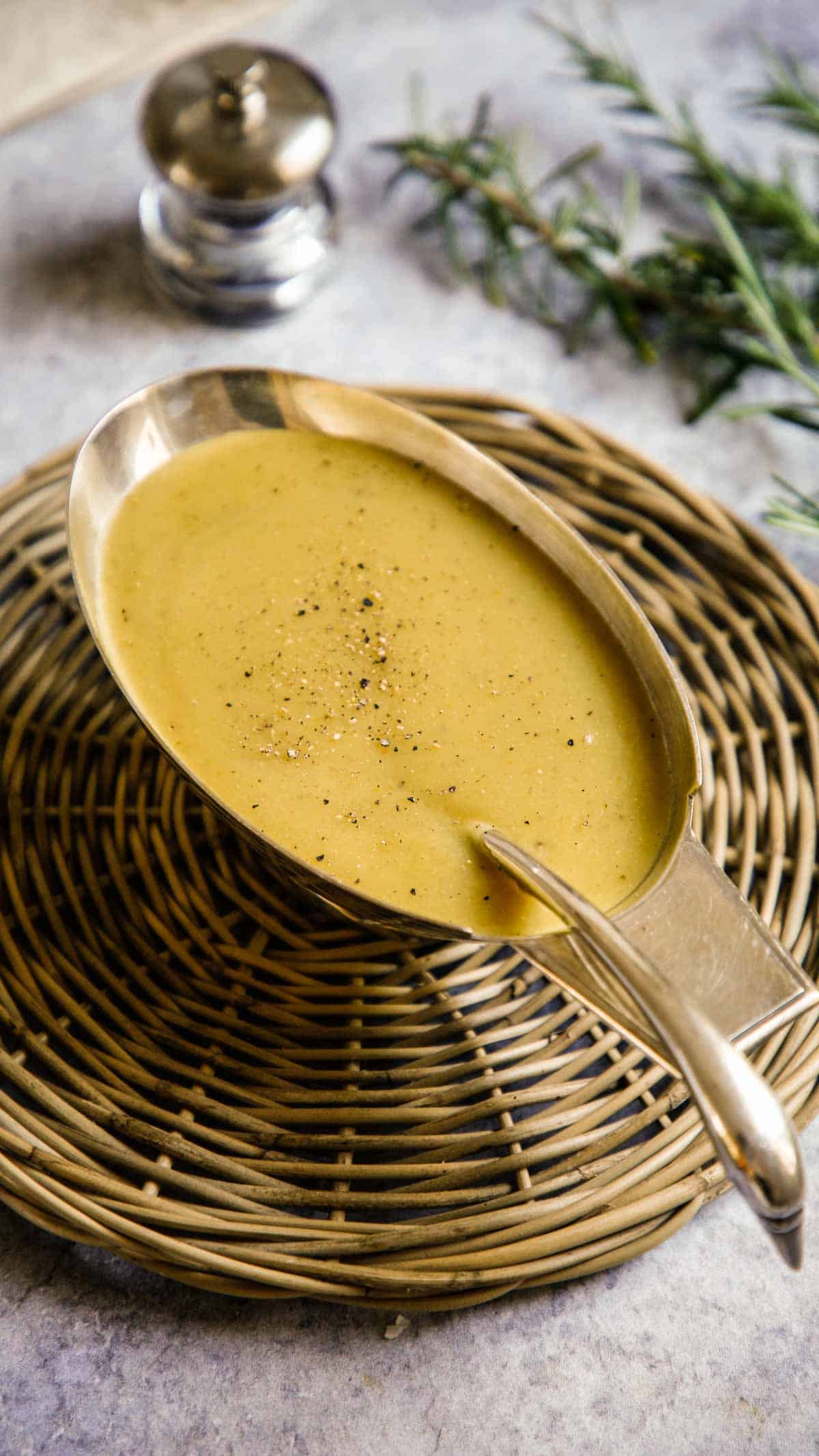 Homemade gravy in a silver gravy boat