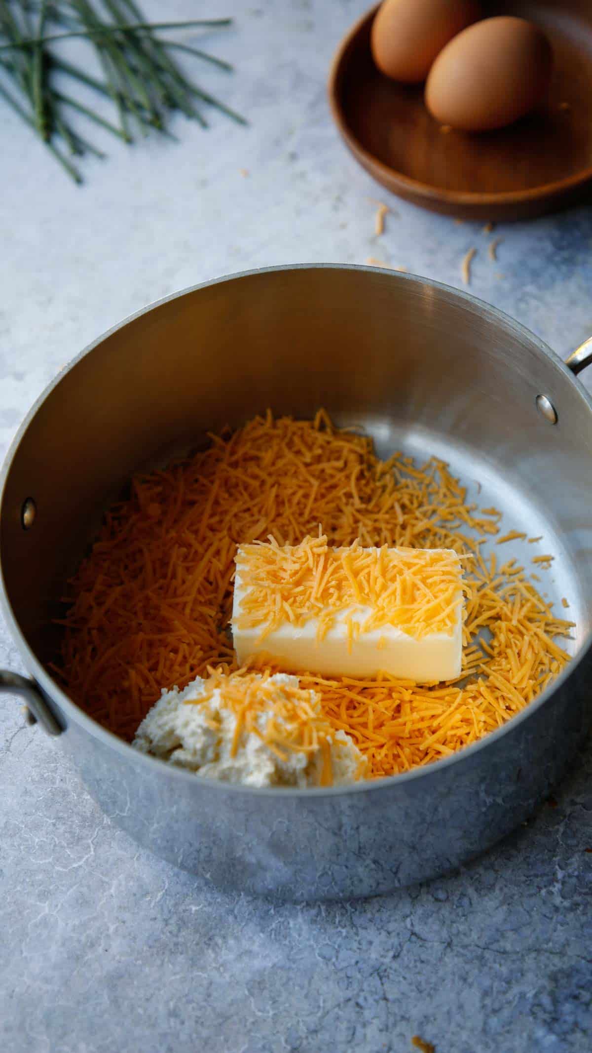 Cheddar CHeese, Butter and Cream Cheese in a pot