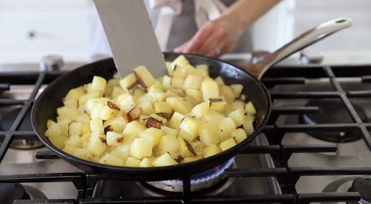 Flipping Home fries in the pan