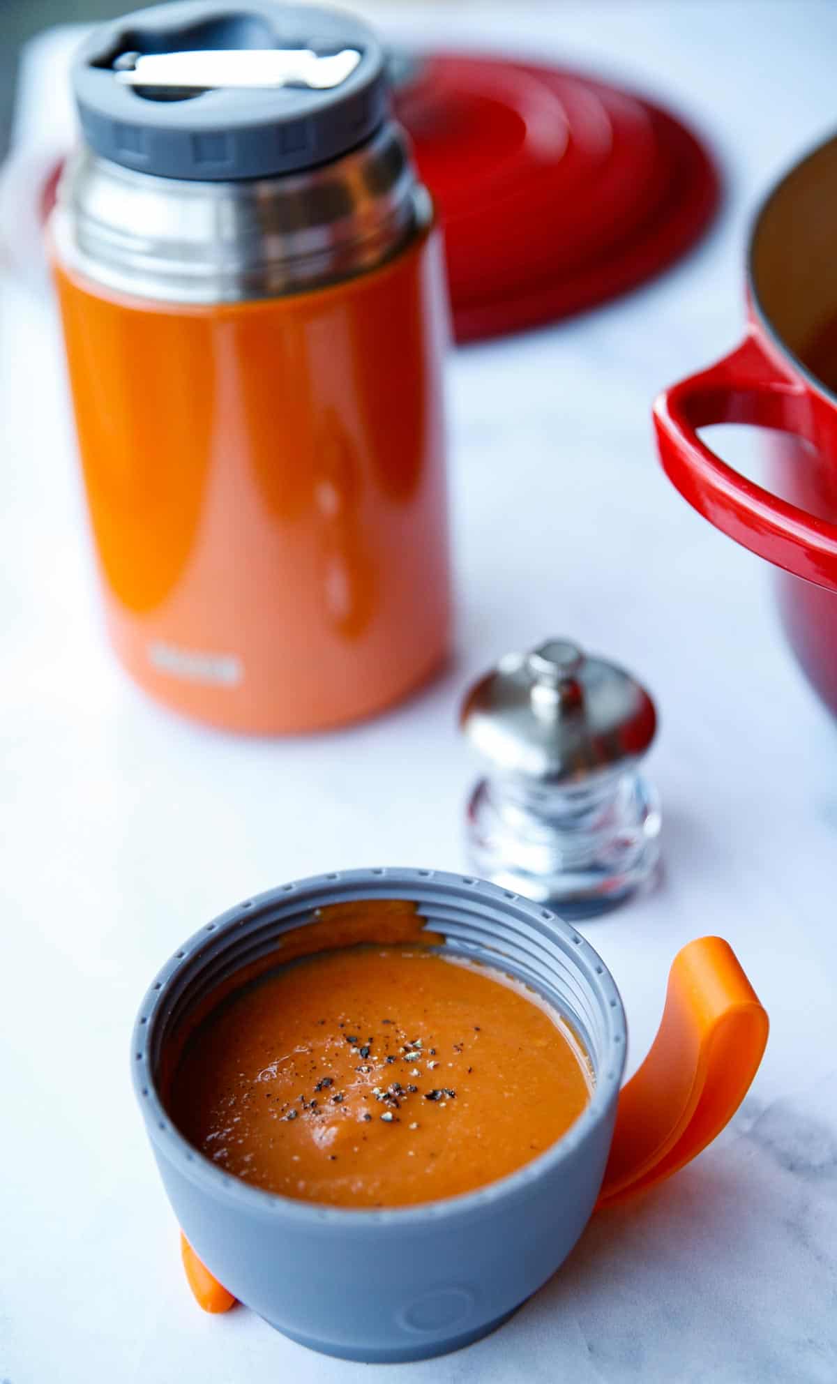 Tomato Soup in a Thermos Cup on a counter