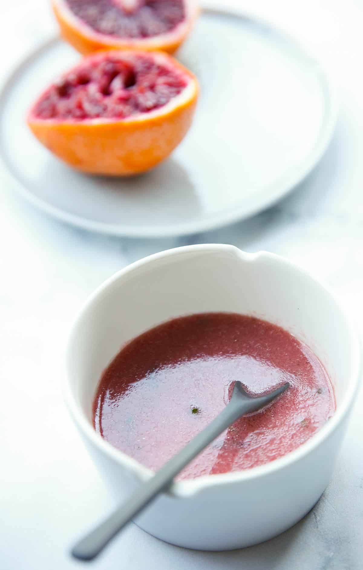 Blood Orange Salad Dressing and Blood Oranges squeezed in the background