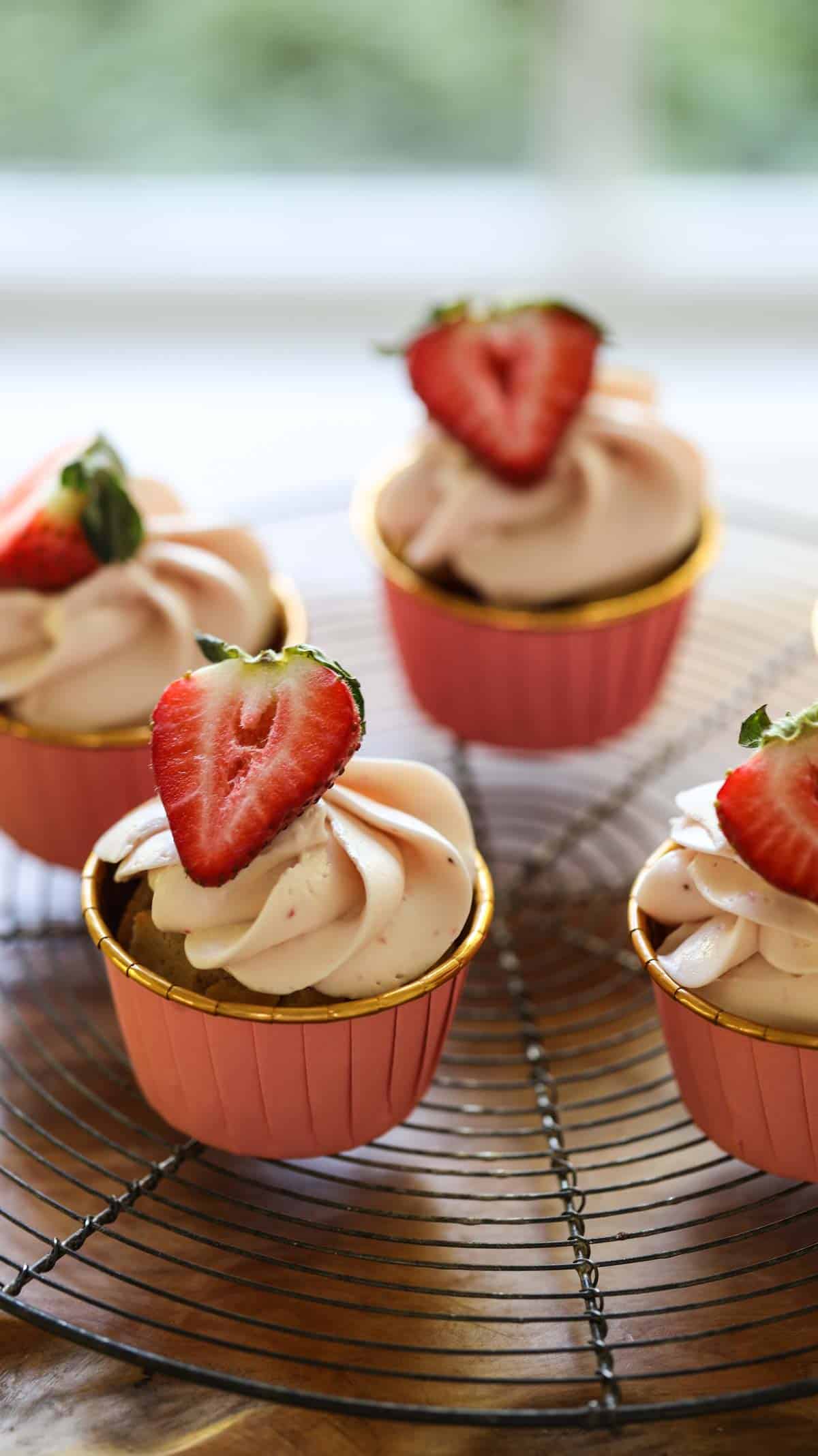 Fresh Strawberry Cupcakes on a colling rack