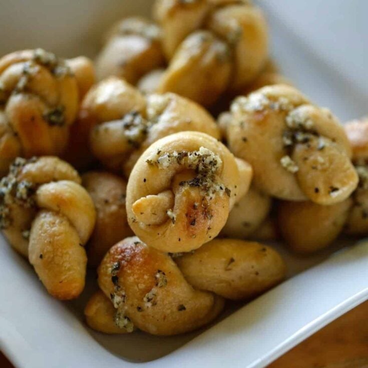 Homemade Garlic Knots Recipe ⬇️ 1 bag pre-made pizza dough - let