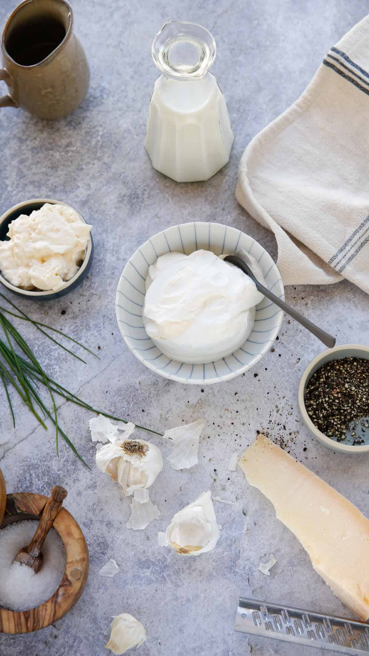 ingredients on a countwr for parmesan peppercorn dressing