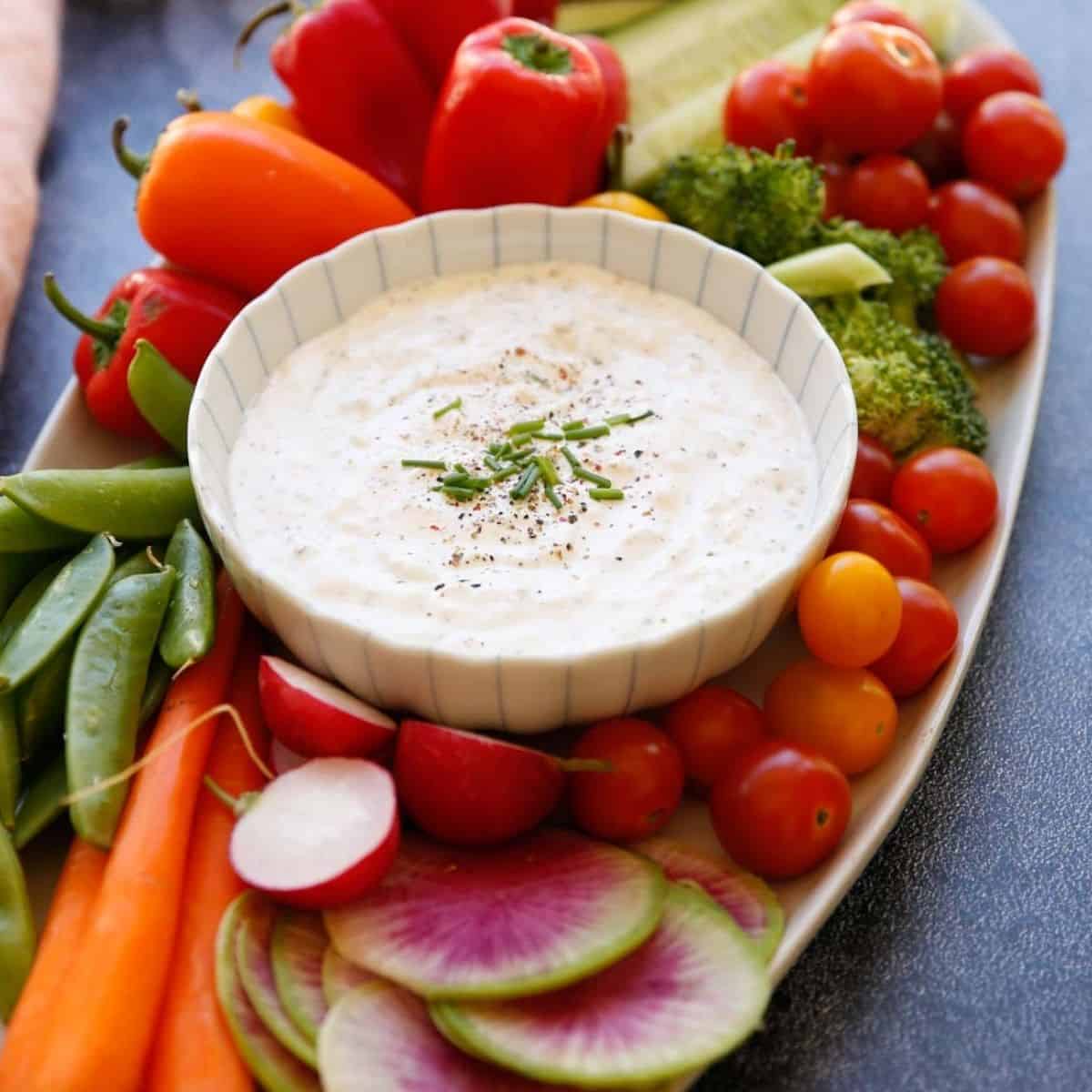 Parmesan Peppercorn Dressing in a bowl with vegetables